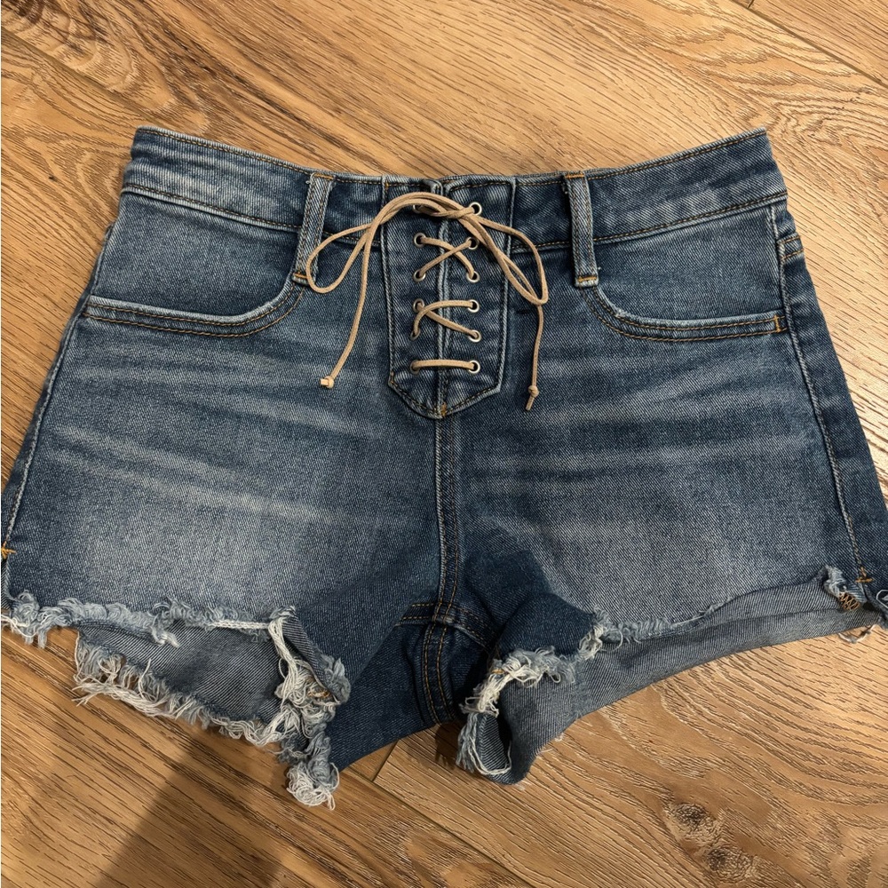 Stretchy lace up jean shorts